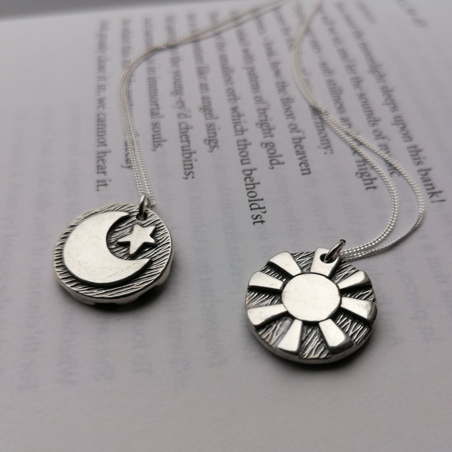 Reversible day and night pendants