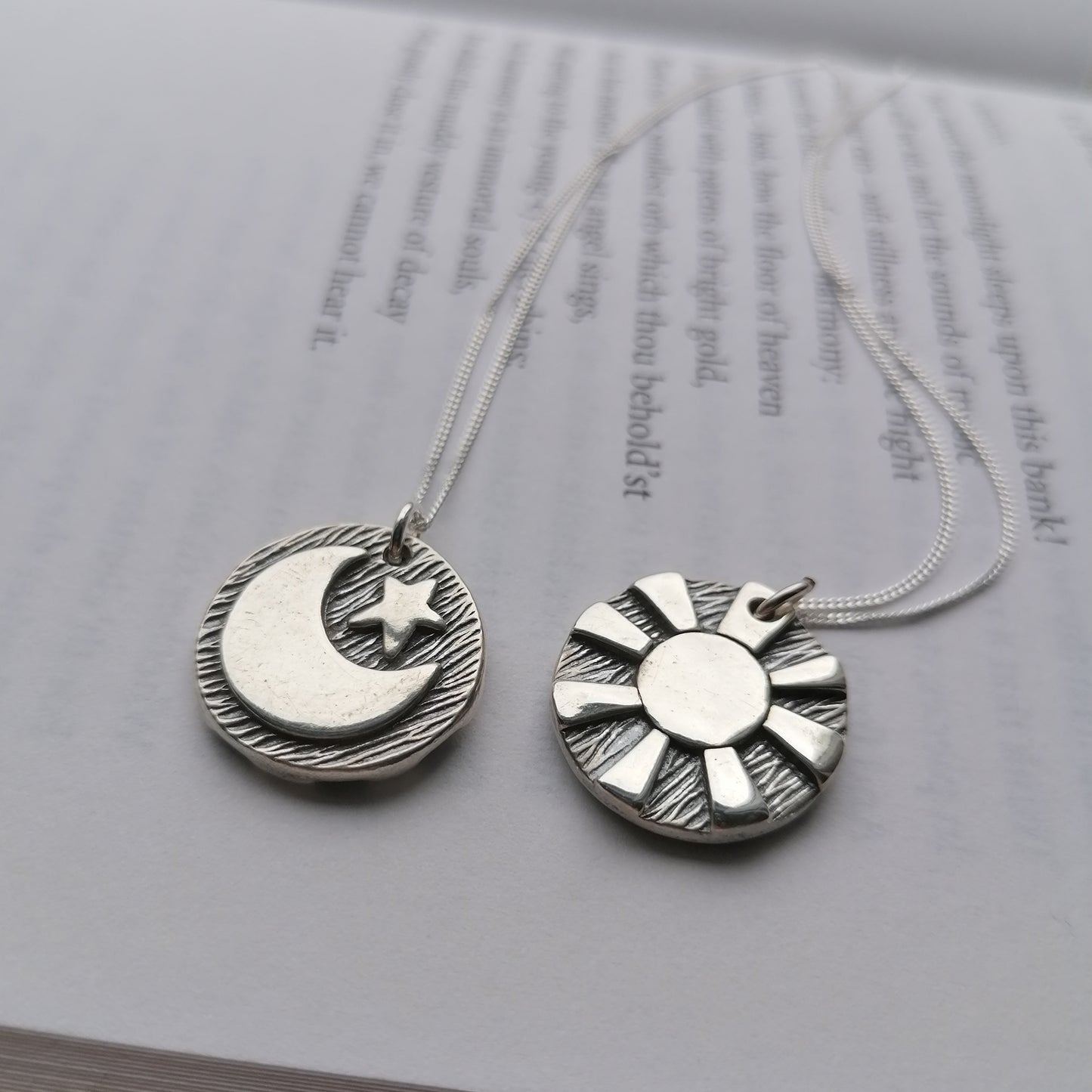 Reversible day and night pendants