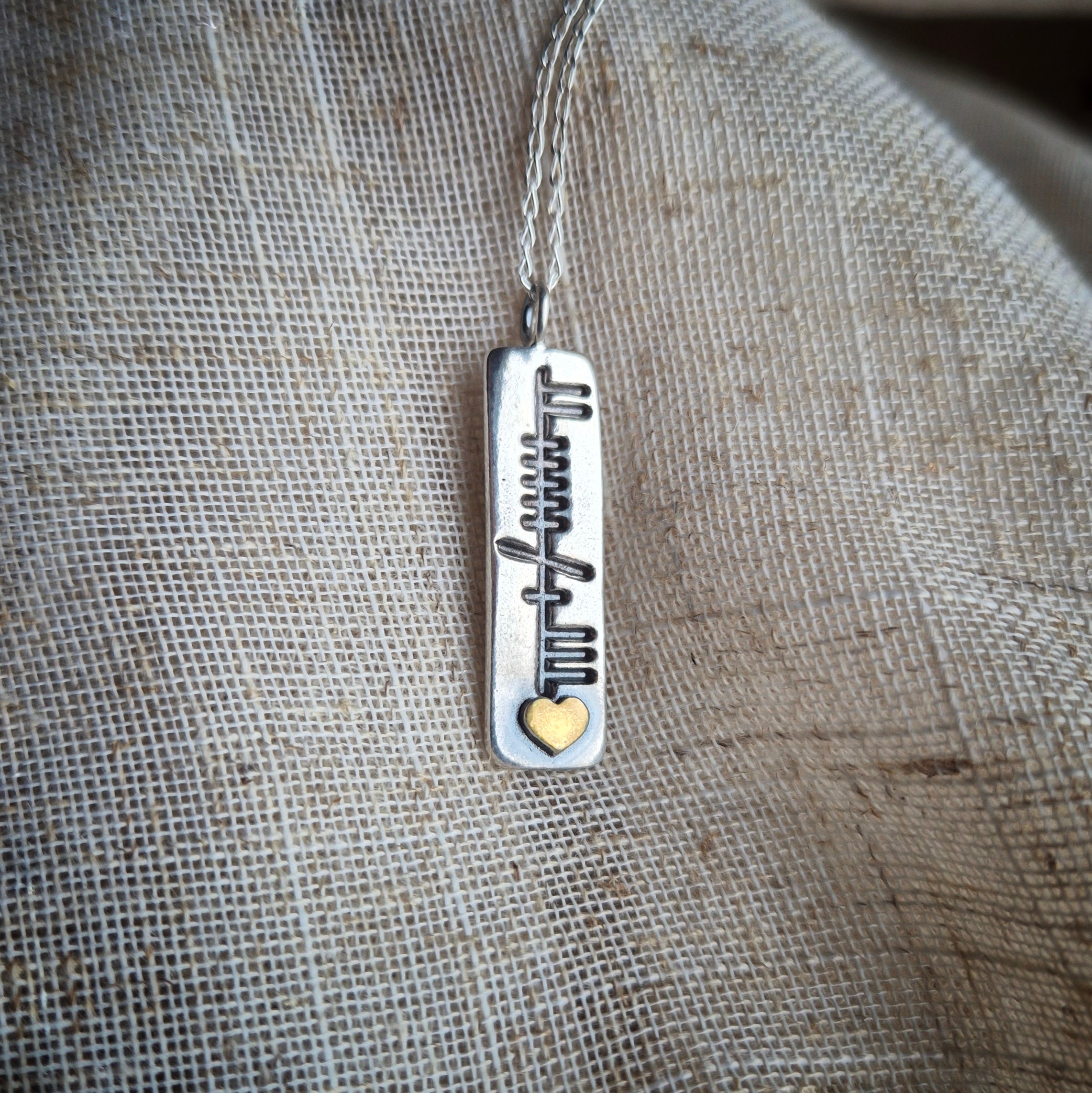 Family ogham pendant with gold heart