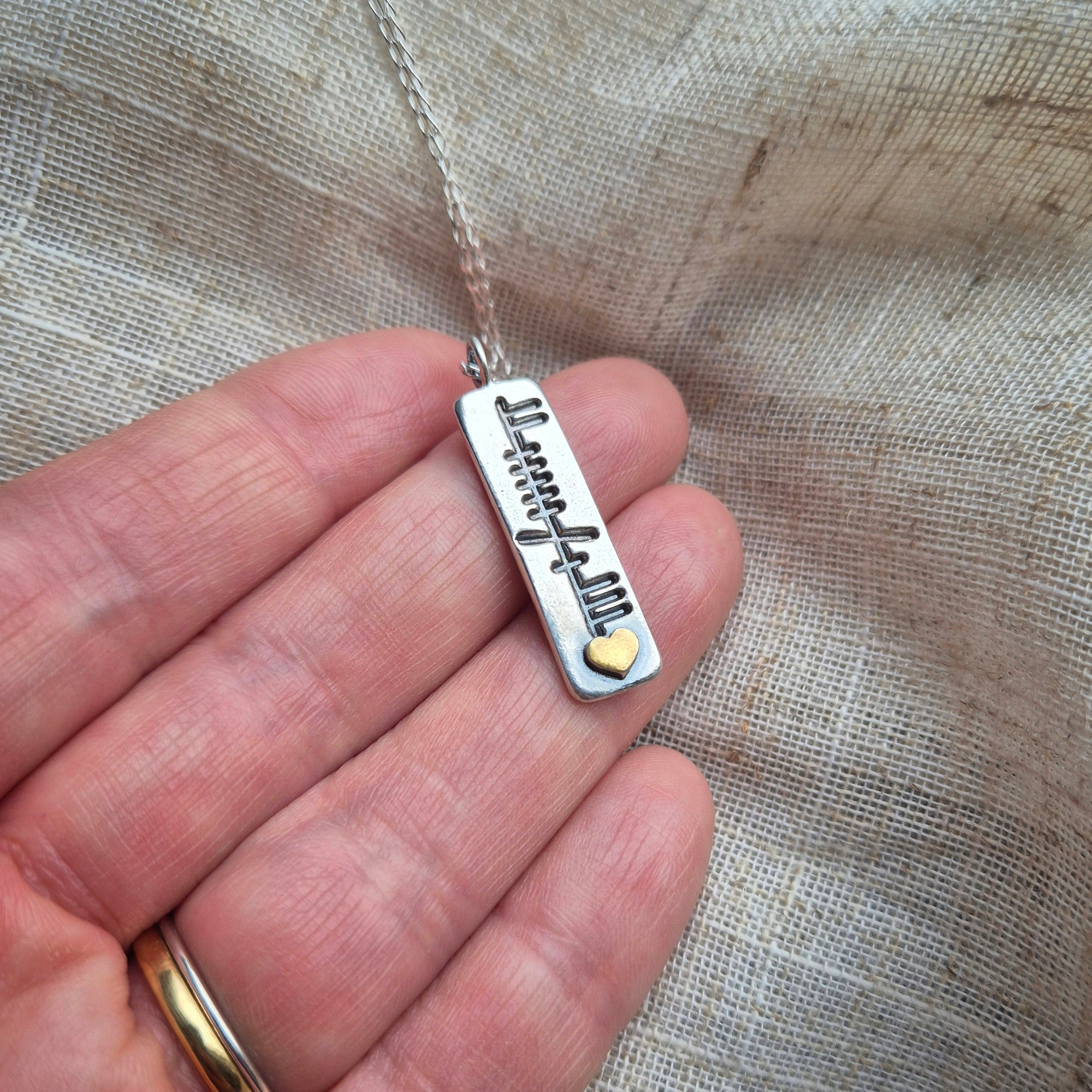 Family ogham pendant with gold heart
