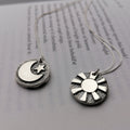 Reversible day and night pendants
