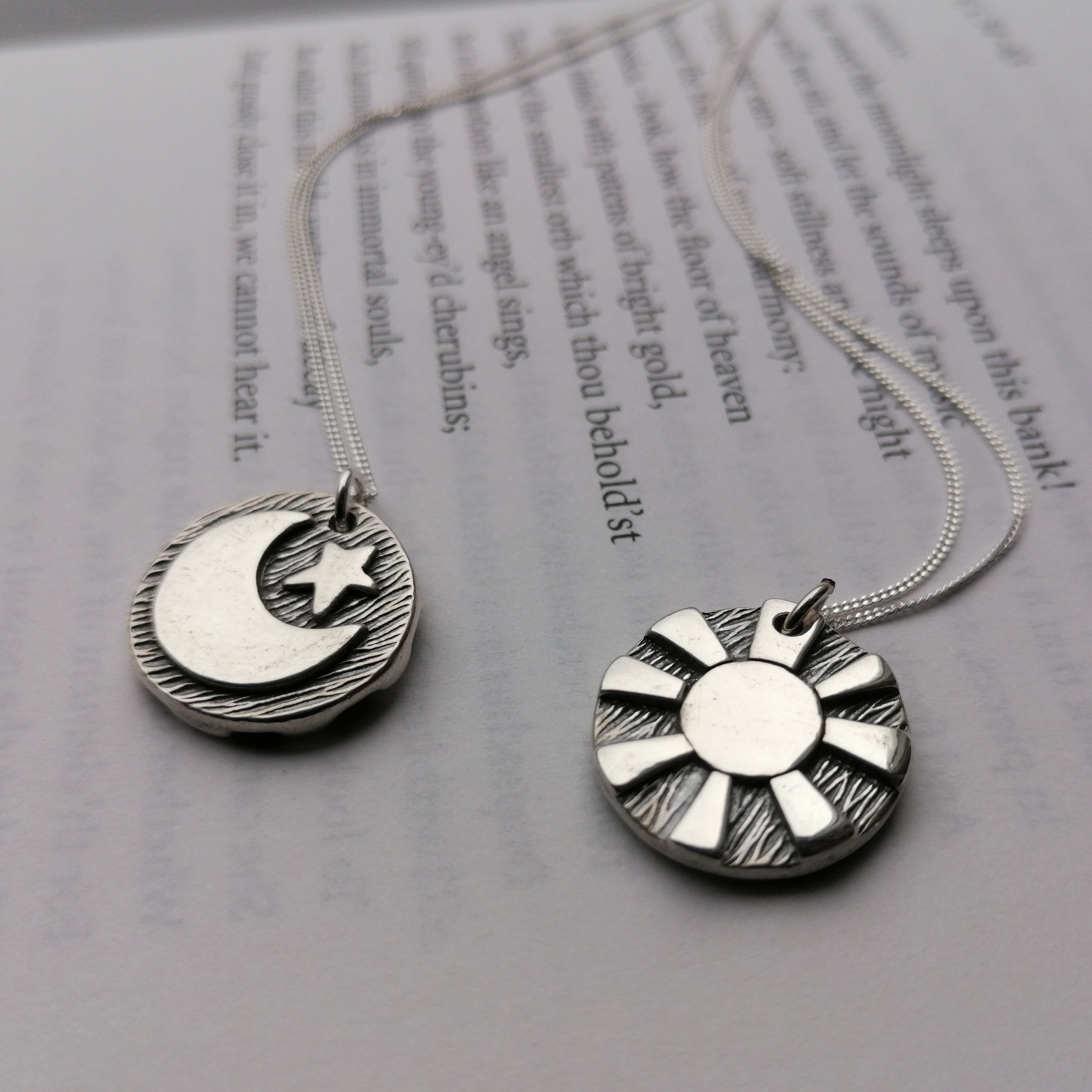 Reversible day and night pendants